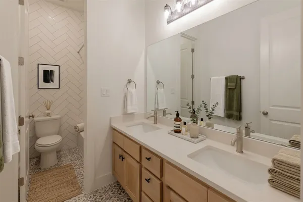 an aerial view of a house with a yard and lake view in back