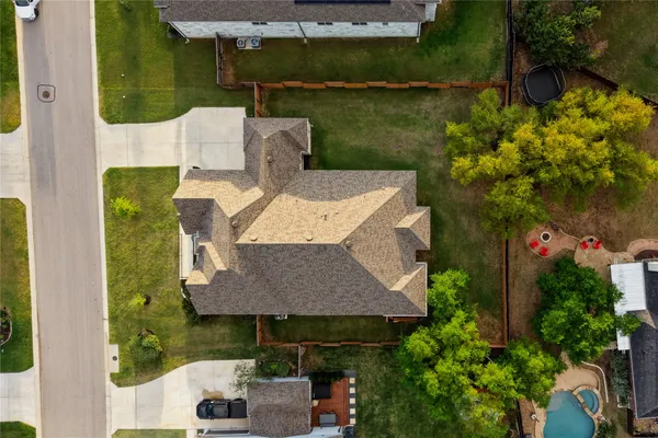 a backyard of a house with table and chairs