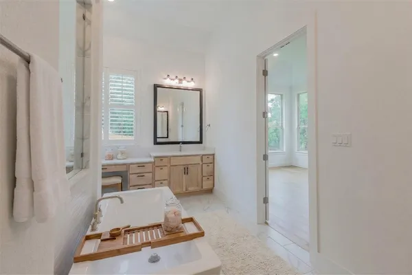 a kitchen with a stove a sink and a refrigerator