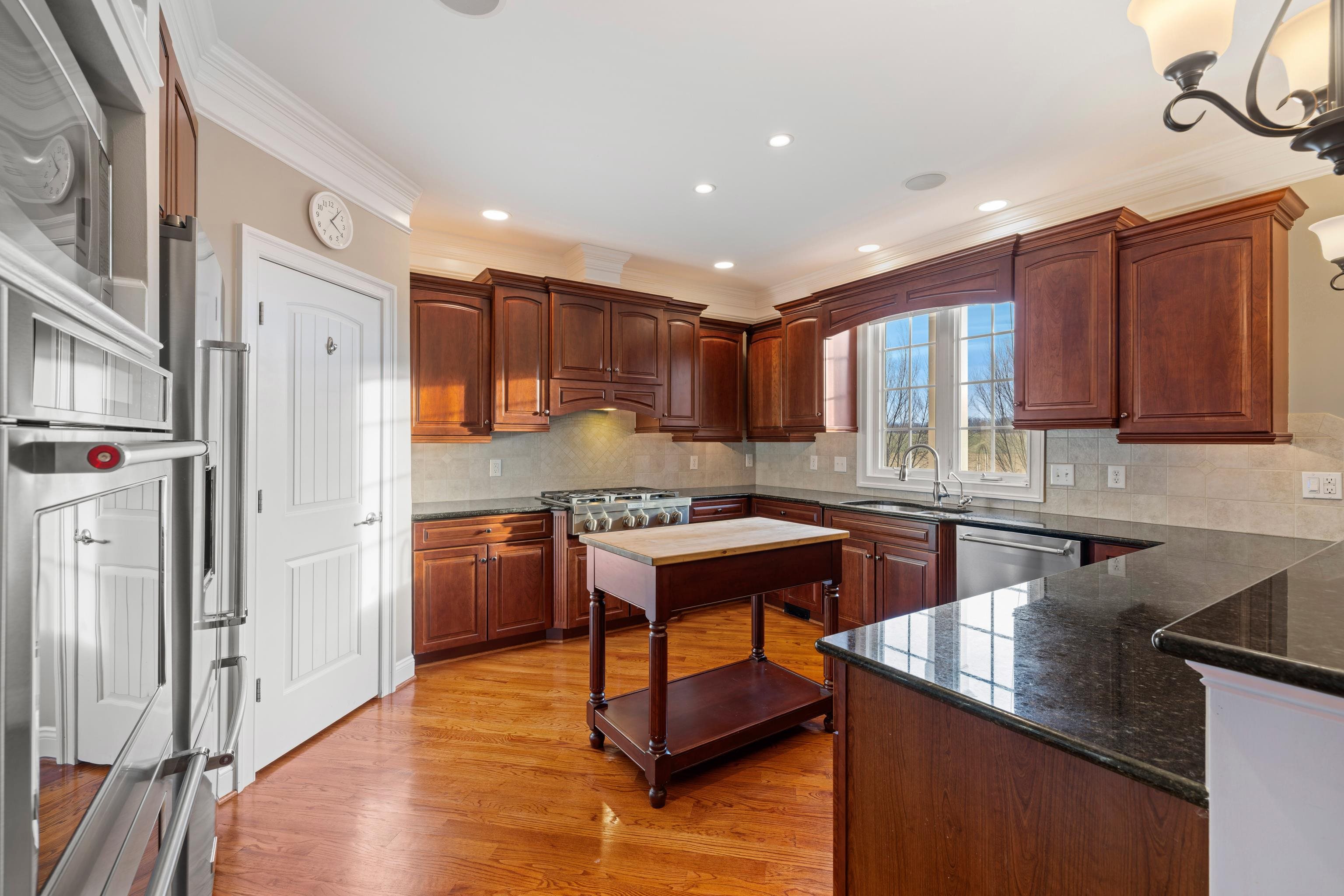 3485 Barterbrook Road Staunton, VA 24401 - Photo 13 of 71 a kitchen with stainless steel appliances granite countertop a refrigerator a sink dishwasher a stove and white countertops with wooden floor