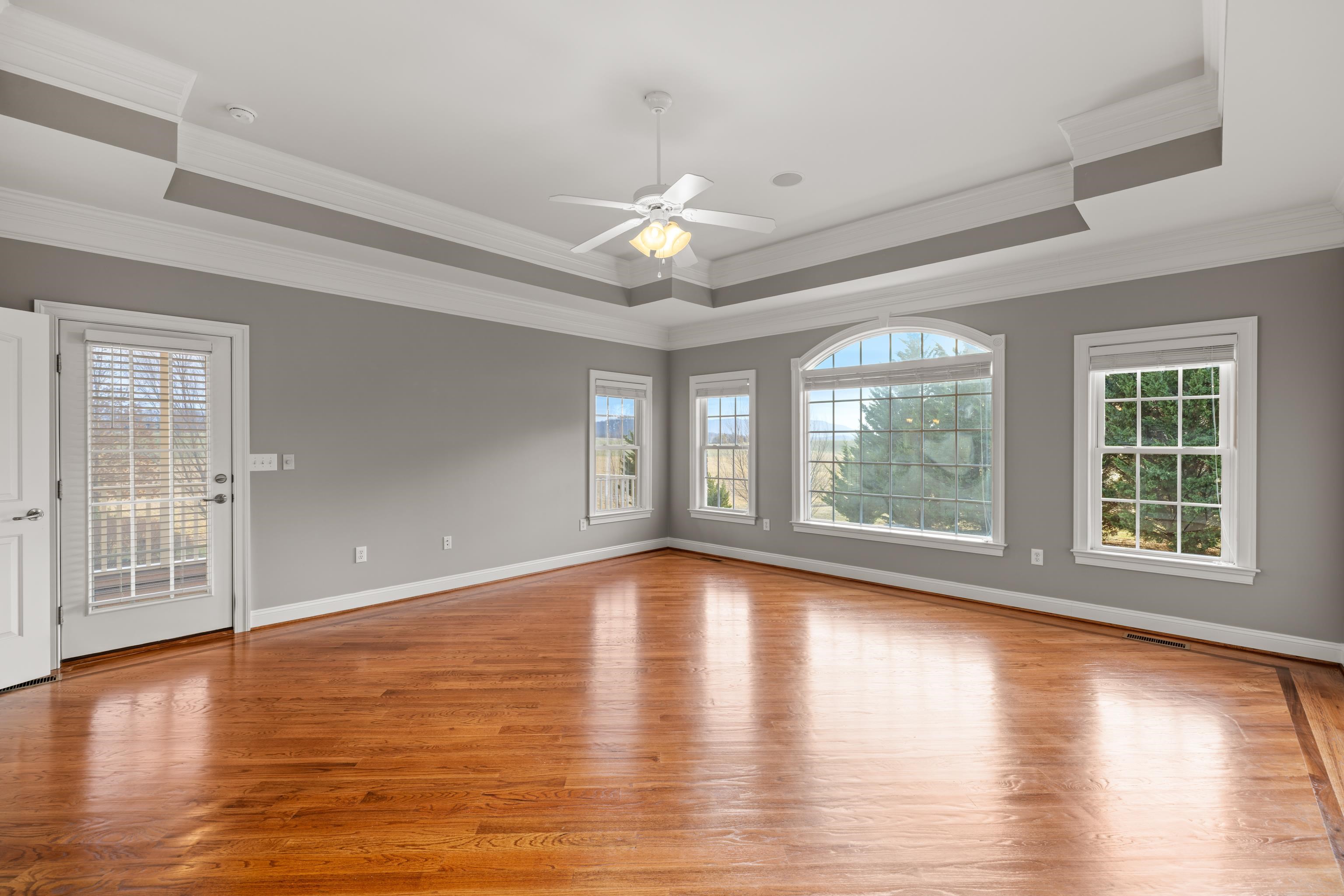3485 Barterbrook Road Staunton, VA 24401 - Photo 27 of 71 a view of an empty room with window wooden floor and chandelier