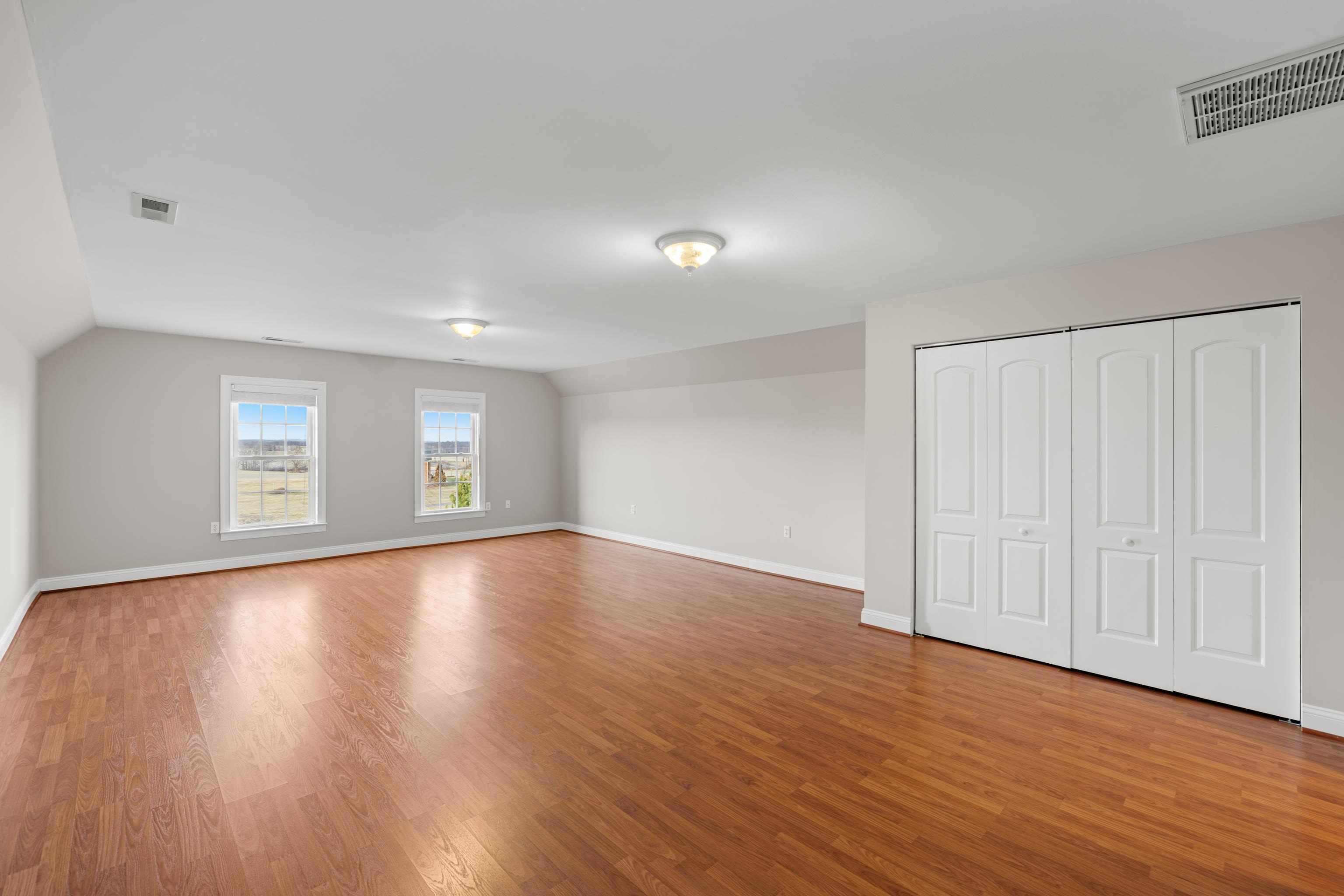 3485 Barterbrook Road Staunton, VA 24401 - Photo 45 of 71 an empty room with wooden floor and windows