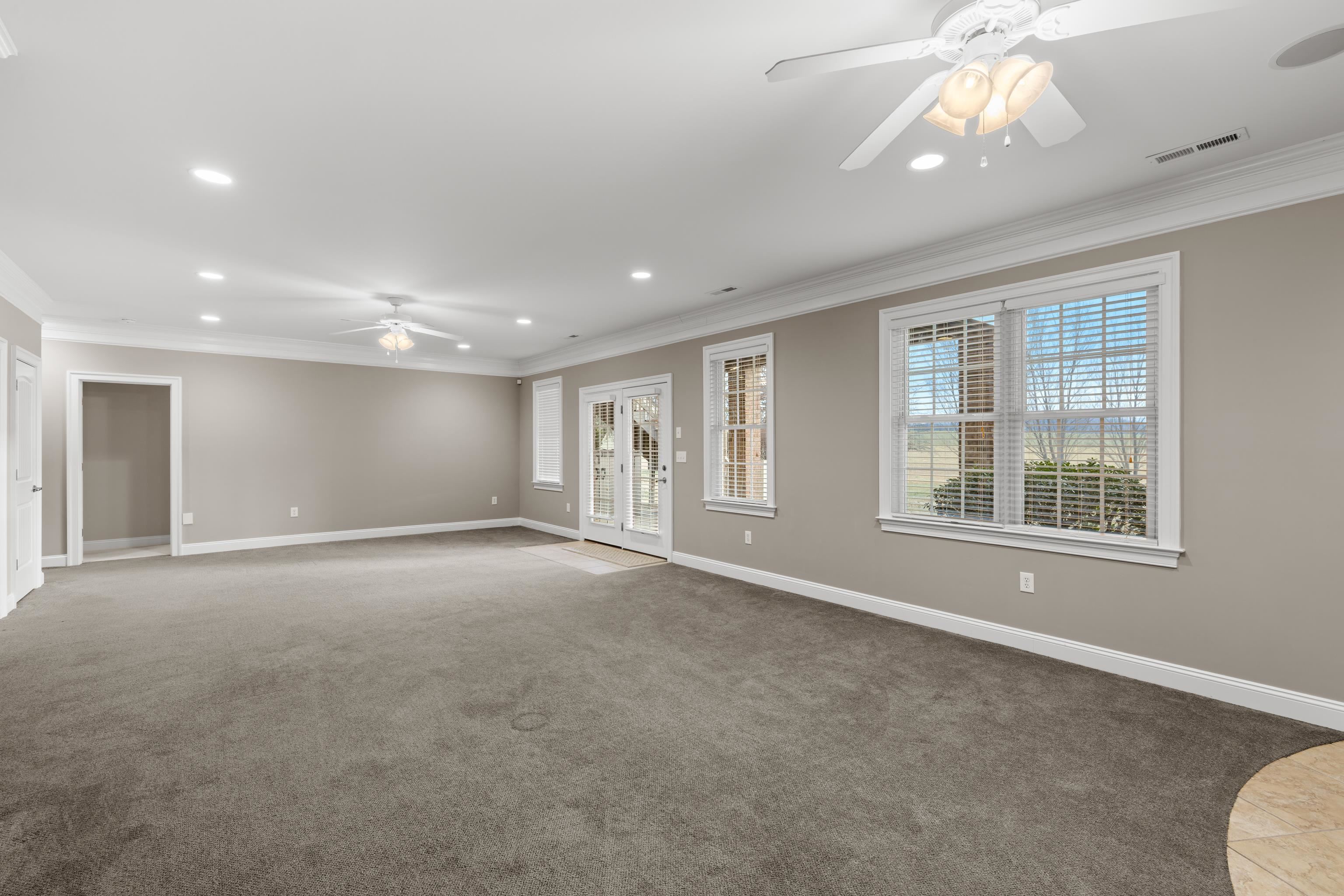3485 Barterbrook Road Staunton, VA 24401 - Photo 48 of 71 a view of an empty room with a window and chandelier fan