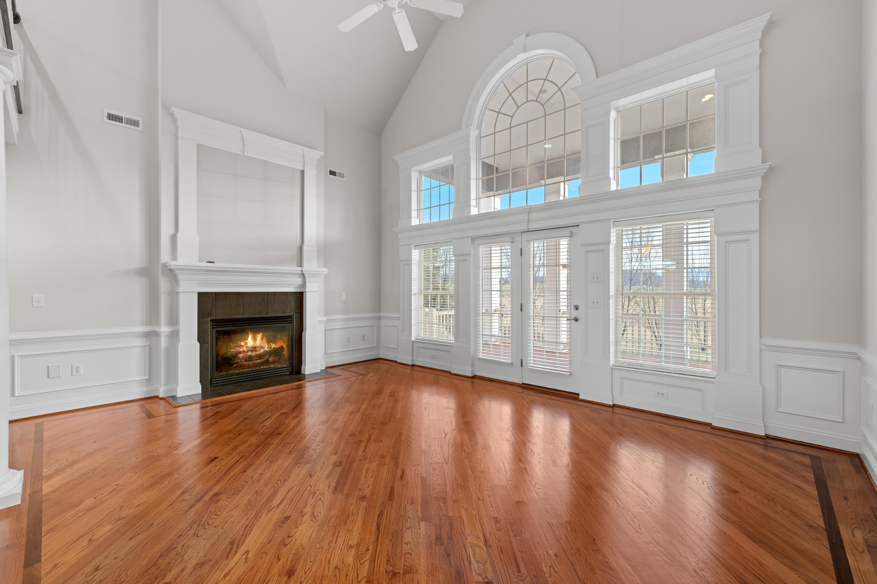 3485 Barterbrook Road Staunton, VA 24401 - Photo 5 of 71 a view of an empty room with wooden floor fireplace and a window