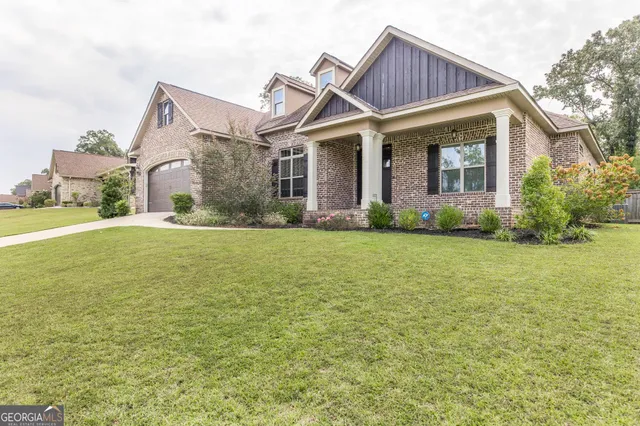 a front view of house with yard and green space