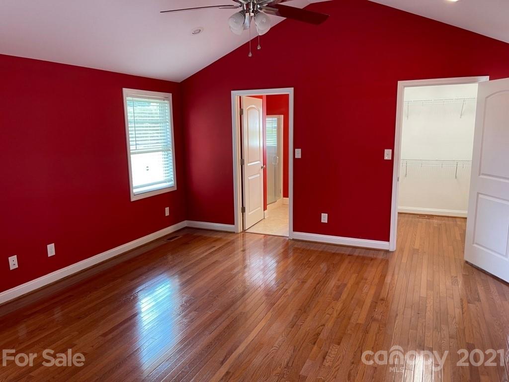 129 Loray Farm Road Dallas, NC 28034 - Photo 14 of 28 a view of an empty room with wooden floor and a window