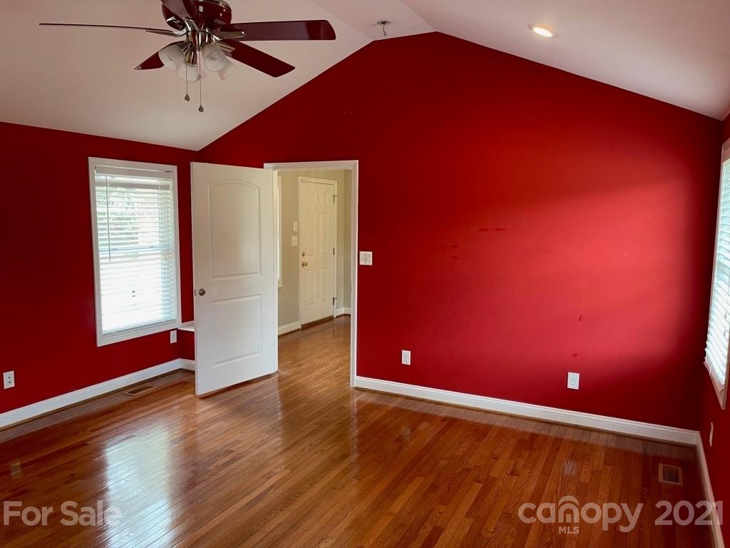 129 Loray Farm Road Dallas, NC 28034 - Photo 16 of 28 an empty room with wooden floor and windows