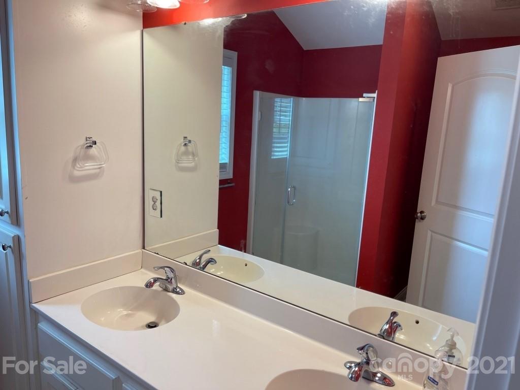 129 Loray Farm Road Dallas, NC 28034 - Photo 18 of 28 a bathroom with a sink and a mirror