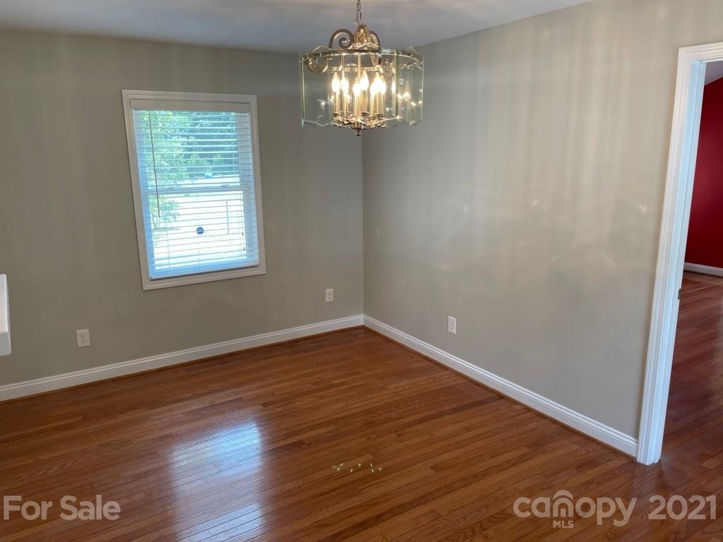 129 Loray Farm Road Dallas, NC 28034 - Photo 19 of 28 a view of empty room with wooden floor