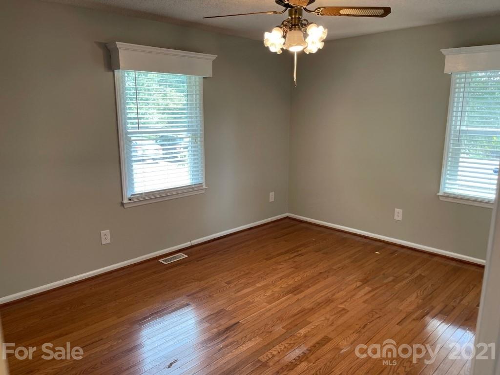 129 Loray Farm Road Dallas, NC 28034 - Photo 25 of 28 a view of wooden floor and windows in a room
