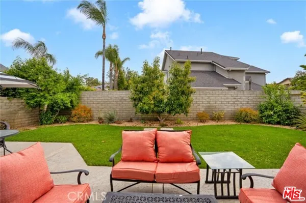a view of a yard with furniture