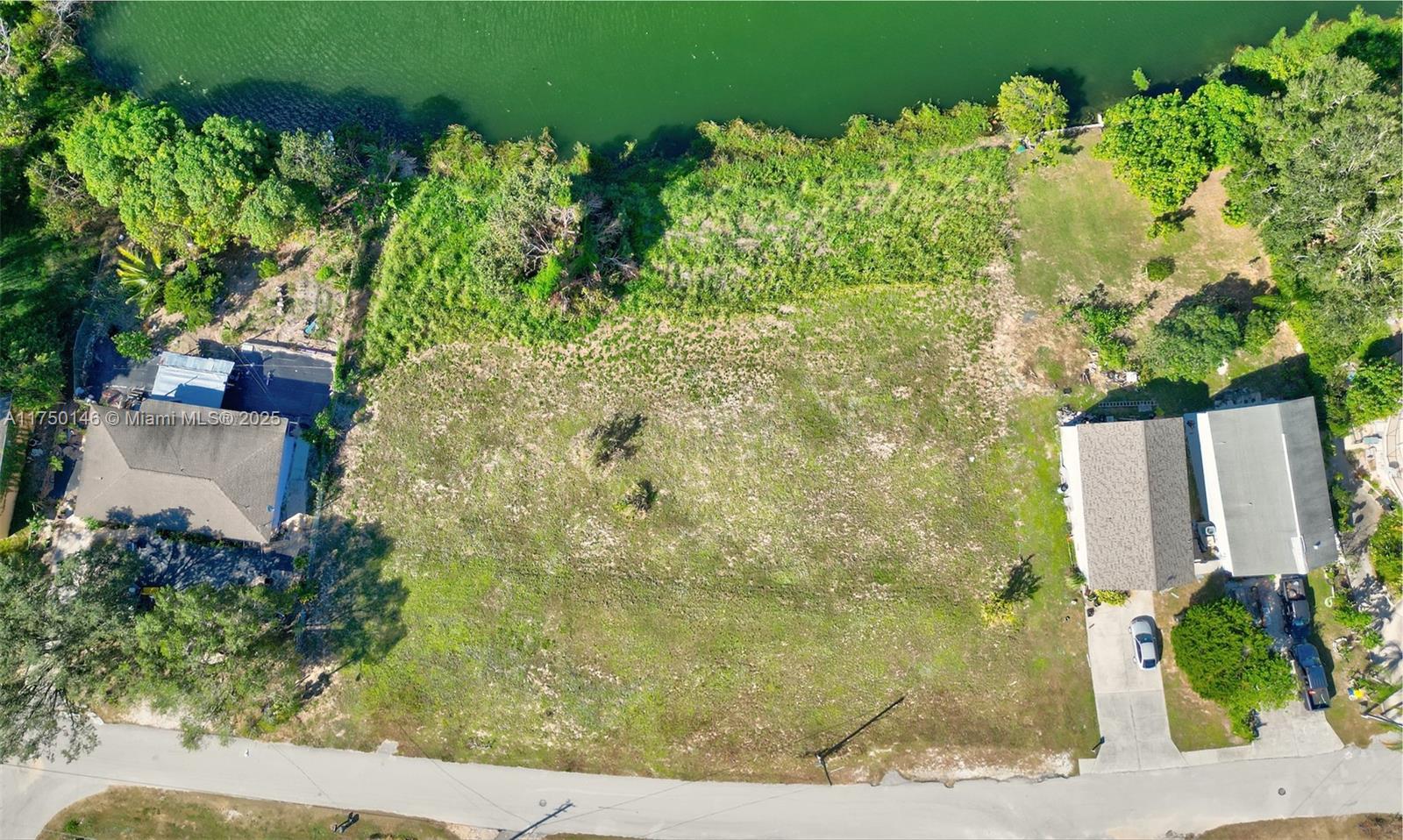 219 Lake Rachard Boulevard Lake Placid, FL 33852 - Photo 5 of 9 an aerial view of a house with a yard