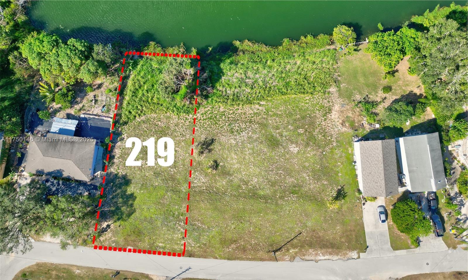 219 Lake Rachard Boulevard Lake Placid, FL 33852 - Photo 6 of 9 a sign that is sitting in front of flowers