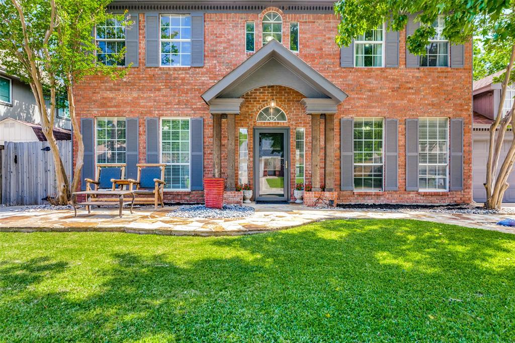 1228 Concho Drive Benbrook, TX 76126 - Photo 2 of 39 Brick exterior with grey shutters, a covered front entry, and multiple windows
