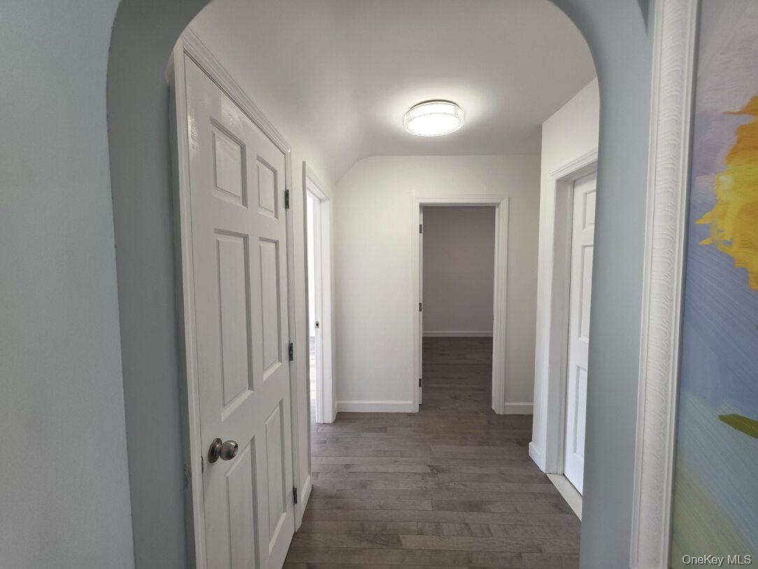 30 Aberdeen Road New Hyde Park, NY 11040 - Photo 28 of 37 a view of a hallway with wooden shelves