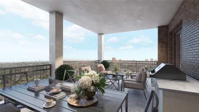 a living room with patio furniture and a floor to ceiling window
