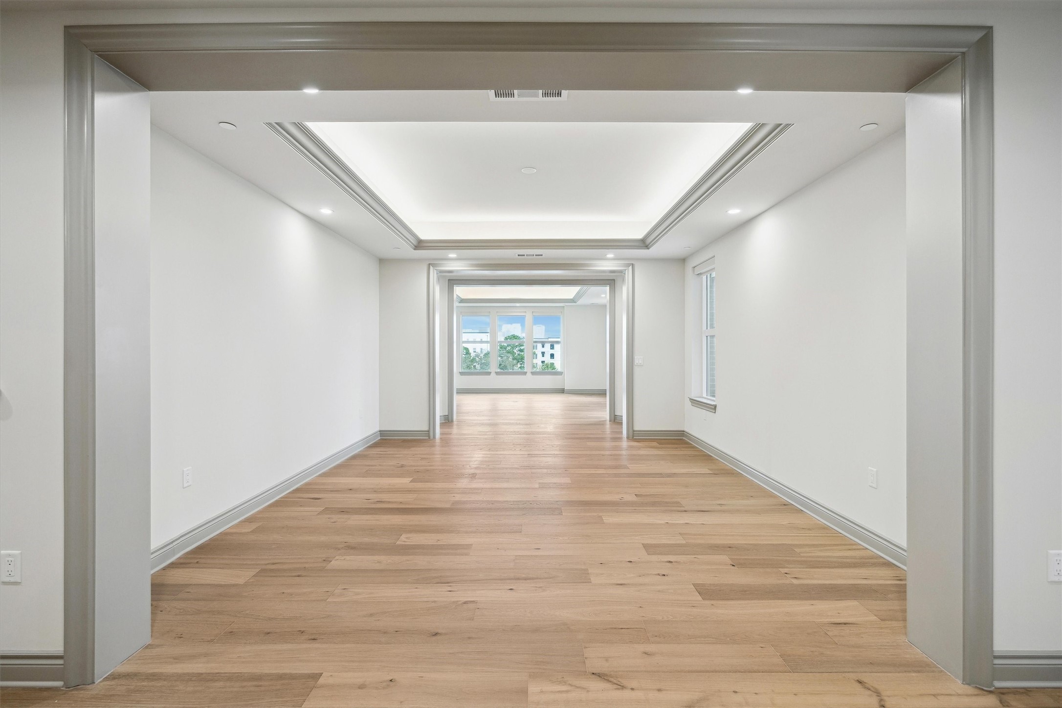 1717 Bissonnet Street, Unit 507 Houston, TX 77005 - Photo 12 of 35 a view of an empty room with wooden floor and a window