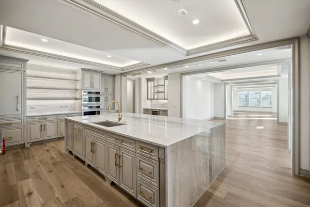 a kitchen with counter top space and sink