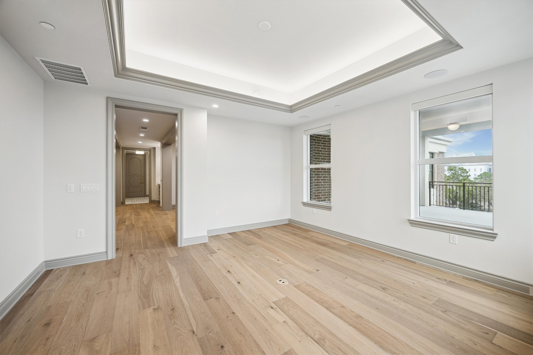 1717 Bissonnet Street, Unit 507 Houston, TX 77005 - Photo 22 of 35 a view of an empty room with wooden floor and a window