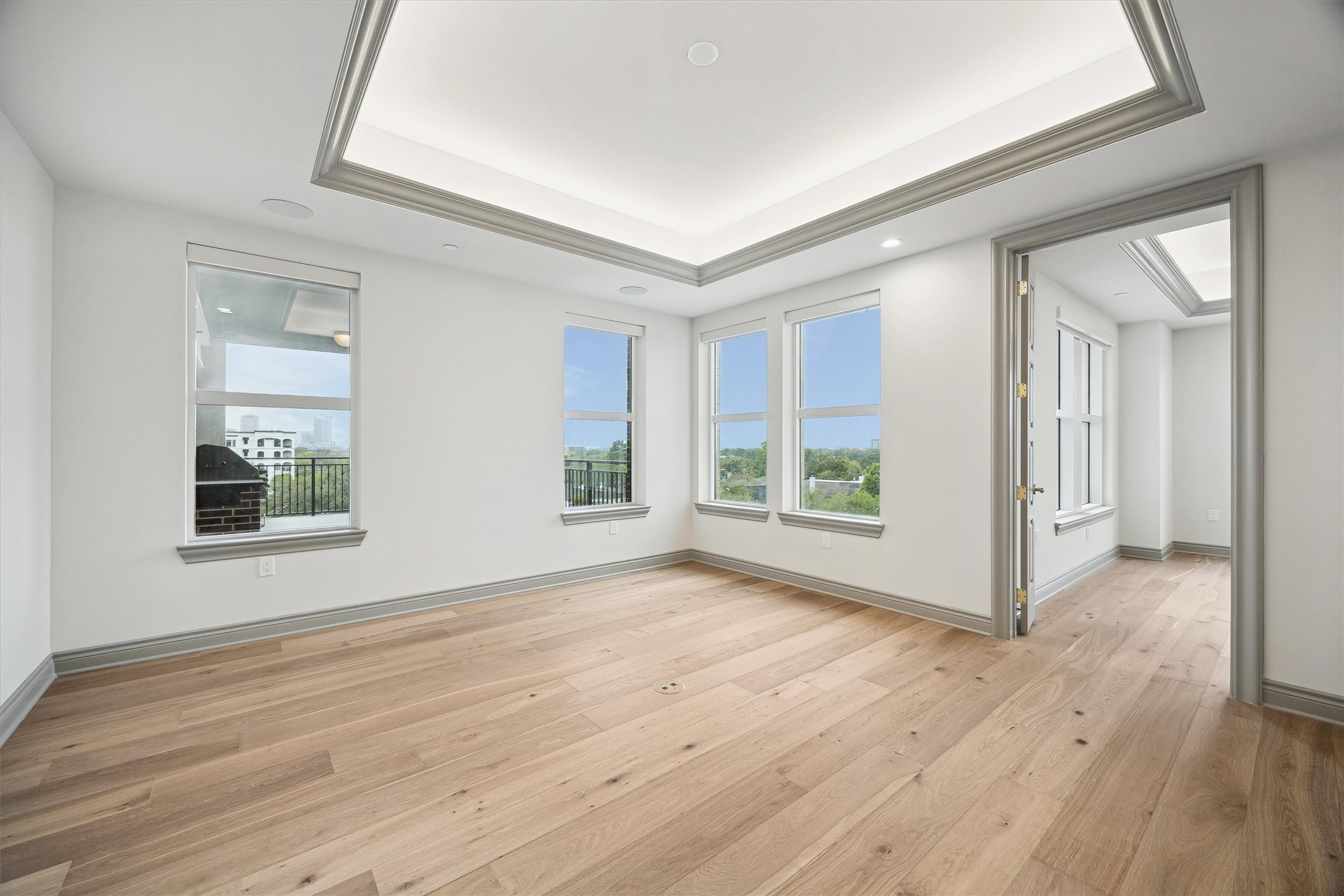1717 Bissonnet Street, Unit 507 Houston, TX 77005 - Photo 23 of 35 a view of an empty room with wooden floor and a window
