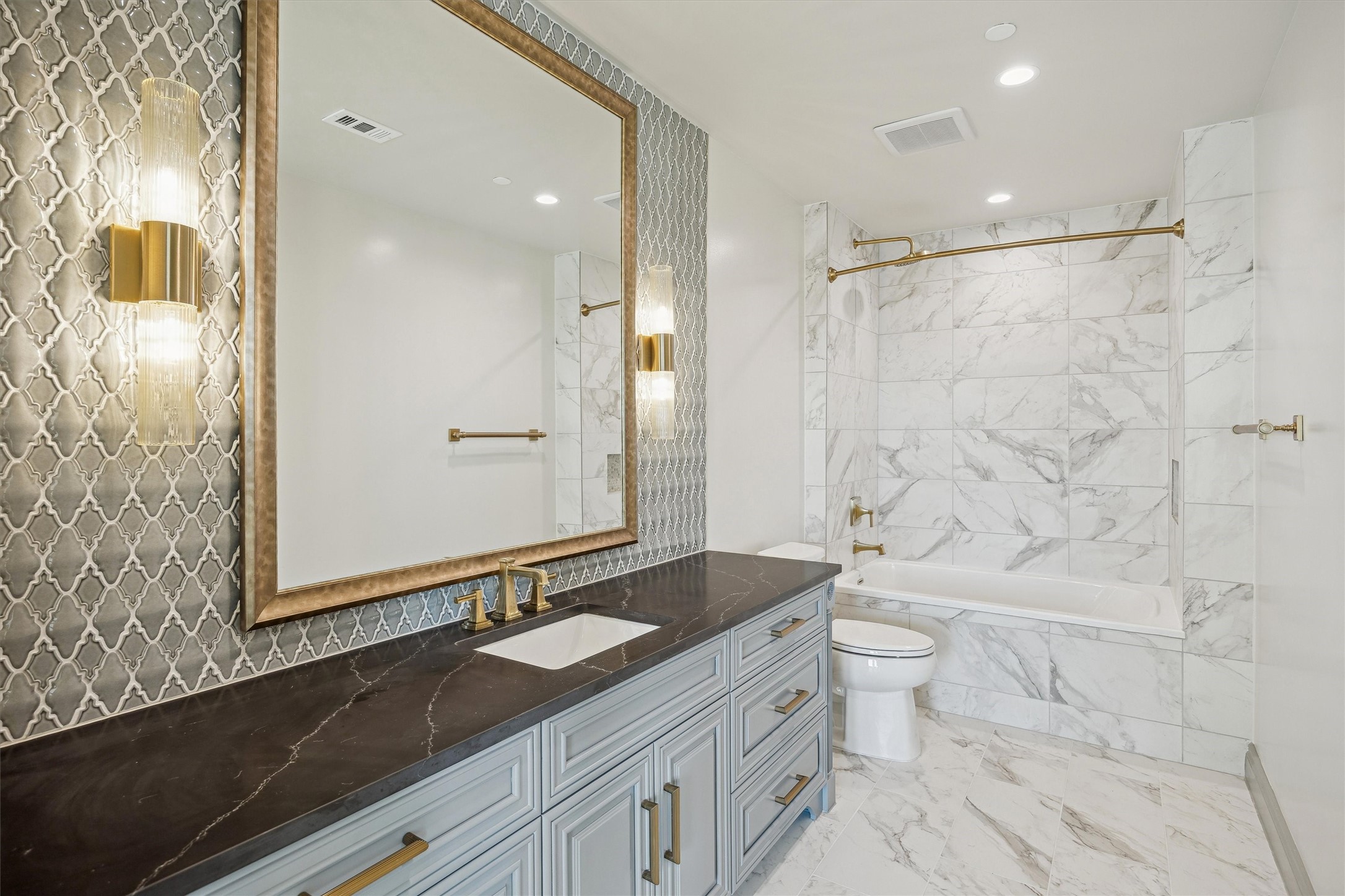 1717 Bissonnet Street, Unit 507 Houston, TX 77005 - Photo 25 of 35 a bathroom with a granite countertop sink toilet and shower
