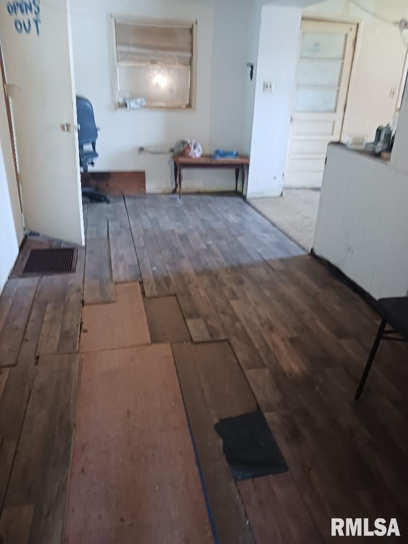 502 East Matthew Street Sesser, IL 62884 - Photo 9 of 18 a view of hallway with stairs and wooden floor