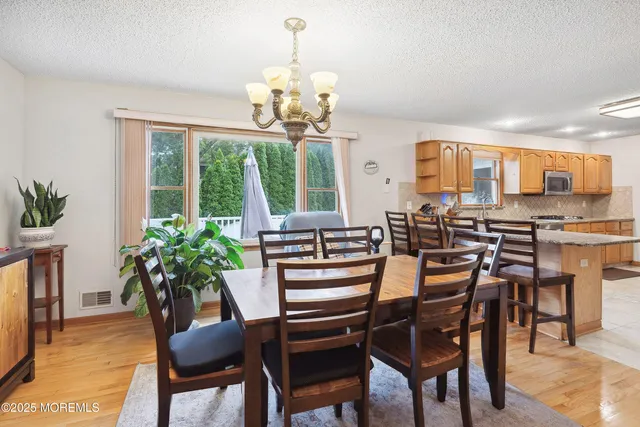 a view of a dining room with furniture window and outside view