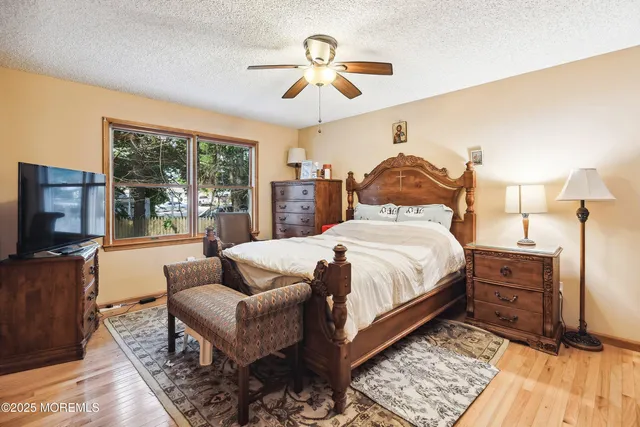 a bed room with a bed and a chandelier