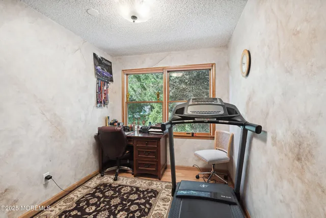 a bedroom with furniture and a window