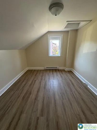 520 Fiot Avenue, Unit 2 Bethlehem, PA 18015 - Photo 19 of 23 an empty room with wooden floor and windows