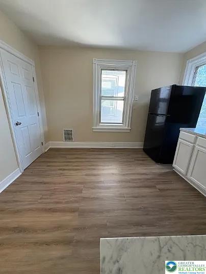 520 Fiot Avenue, Unit 2 Bethlehem, PA 18015 - Photo 21 of 23 wooden floor in an empty room with a window