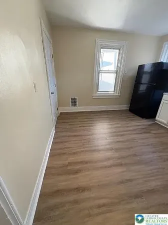 a view of a livingroom with wooden floor