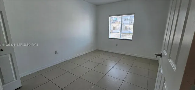 a view of a bathroom from a corridor