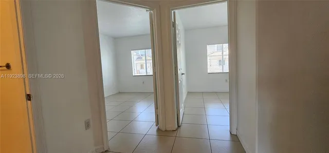 a kitchen with a refrigerator stove and cabinets