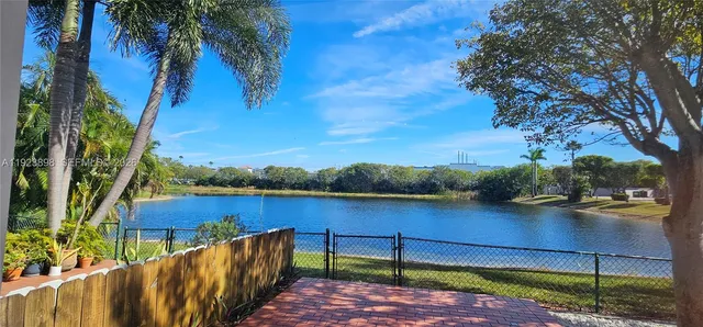 a view of a backyard with sitting area