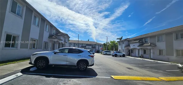 a view of a car parked in front of a building