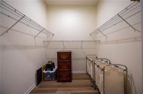 a view of a storage & utility room with racks on the wall