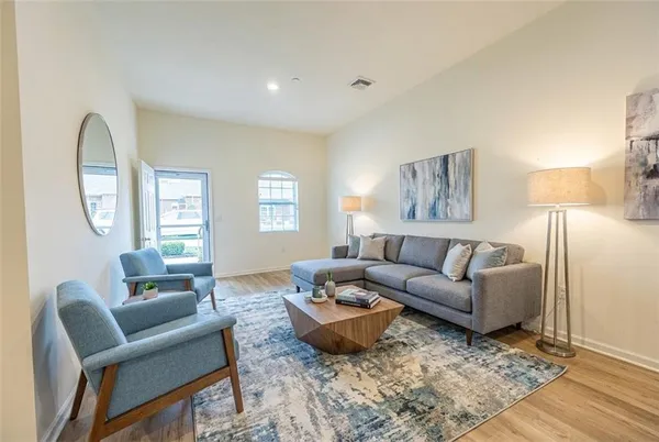 a living room with furniture and a window