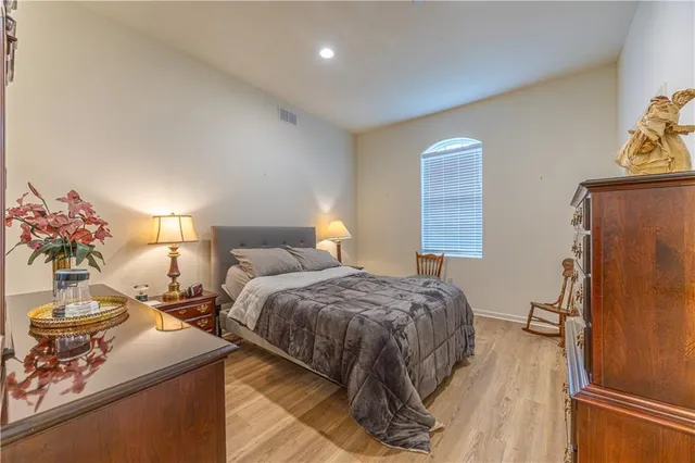 a bedroom with double bed and a window