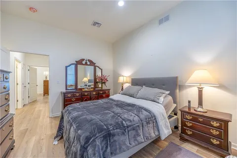 a bed room with a bed and a lamp