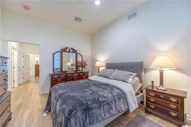 a bed room with a bed and a lamp