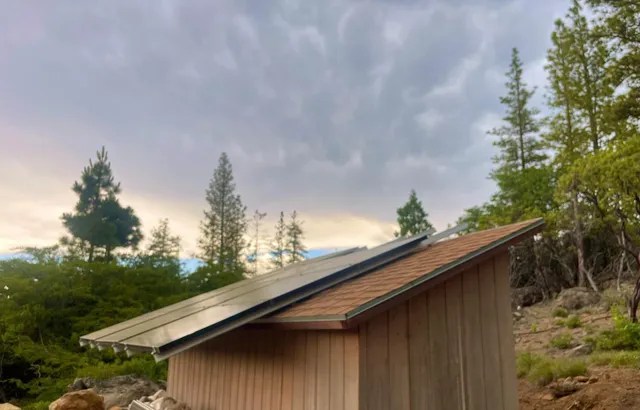 a backyard of a house with large trees