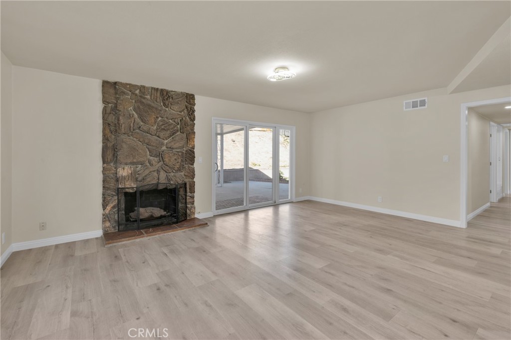 20537 East Vejar Road Walnut, CA 91789 - Photo 11 of 34 wooden floor in an empty room with a fireplace
