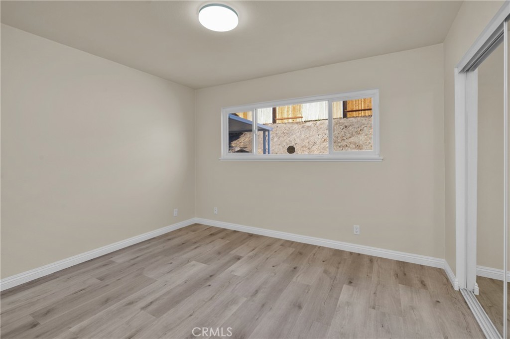 20537 East Vejar Road Walnut, CA 91789 - Photo 19 of 34 an empty room with wooden floor and windows