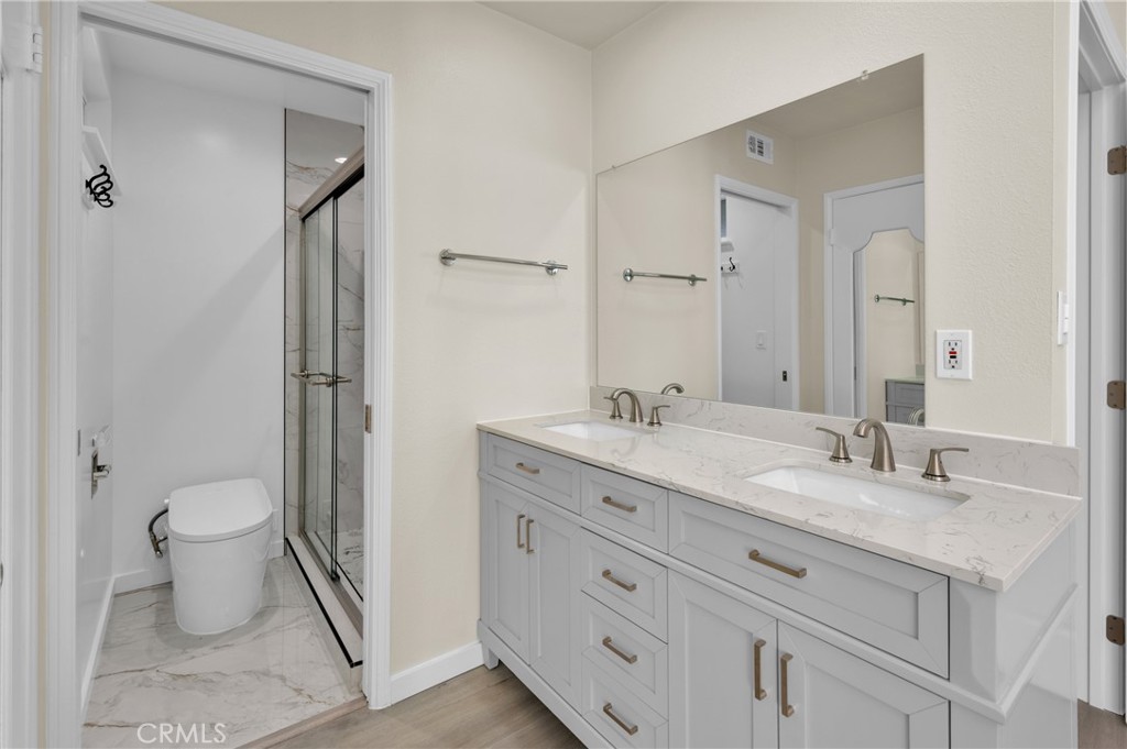20537 East Vejar Road Walnut, CA 91789 - Photo 26 of 34 a bathroom with a granite countertop sink toilet and shower
