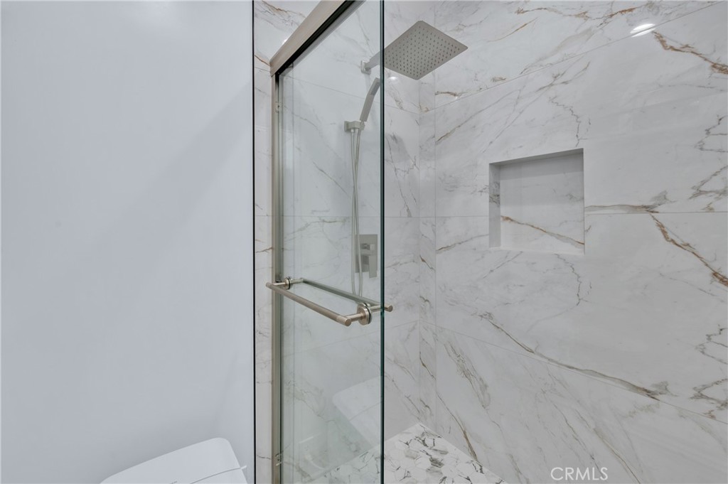 20537 East Vejar Road Walnut, CA 91789 - Photo 27 of 34 a bathroom with a glass shower door