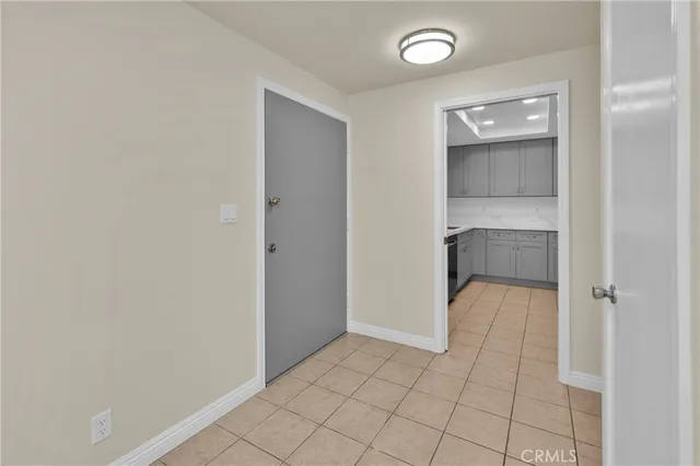 a view of an empty room with a bathroom