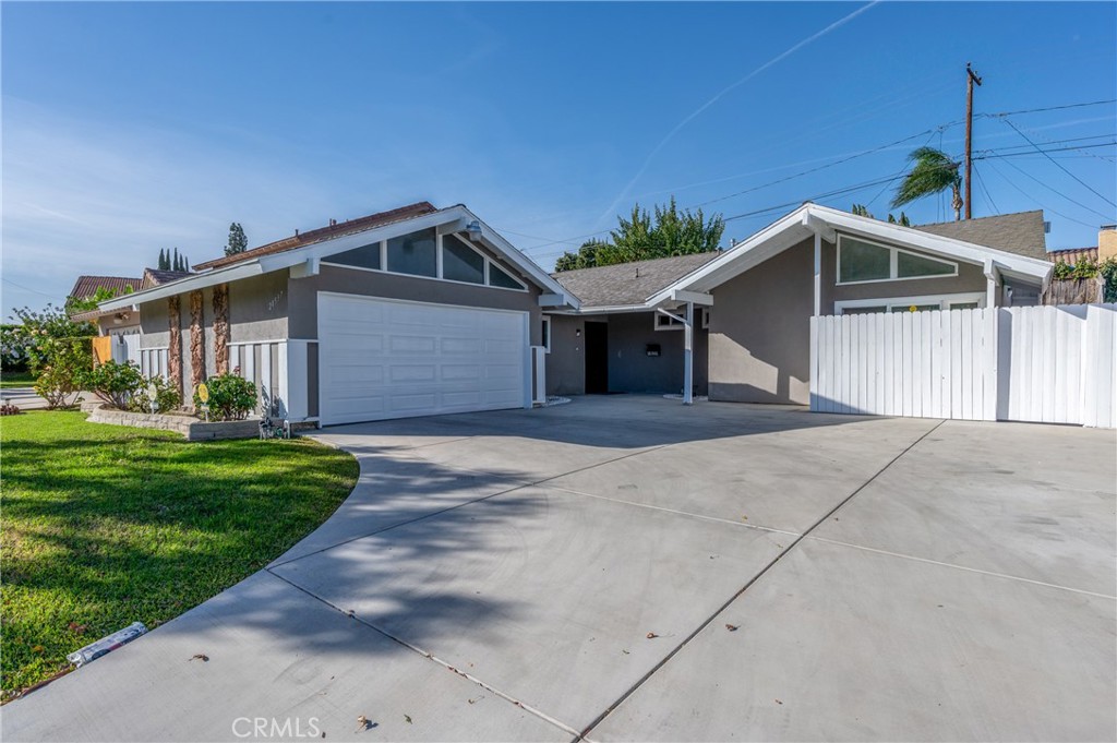 20537 East Vejar Road Walnut, CA 91789 - Photo 10 of 34 a front view of a house with a garden and garage