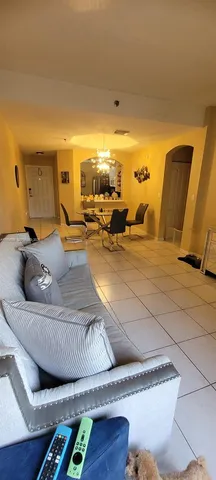 a living room with furniture and a table