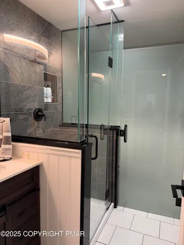 a bathroom with a toilet and a shower curtain